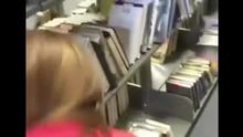 Guy fucks a chick doggy style in a library and busts a load inside of a library book