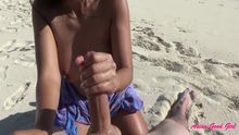 asian good chick jerks a long dong on the beach