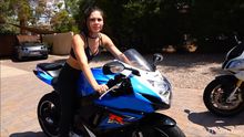 Somara on a gsxr in front of golf course